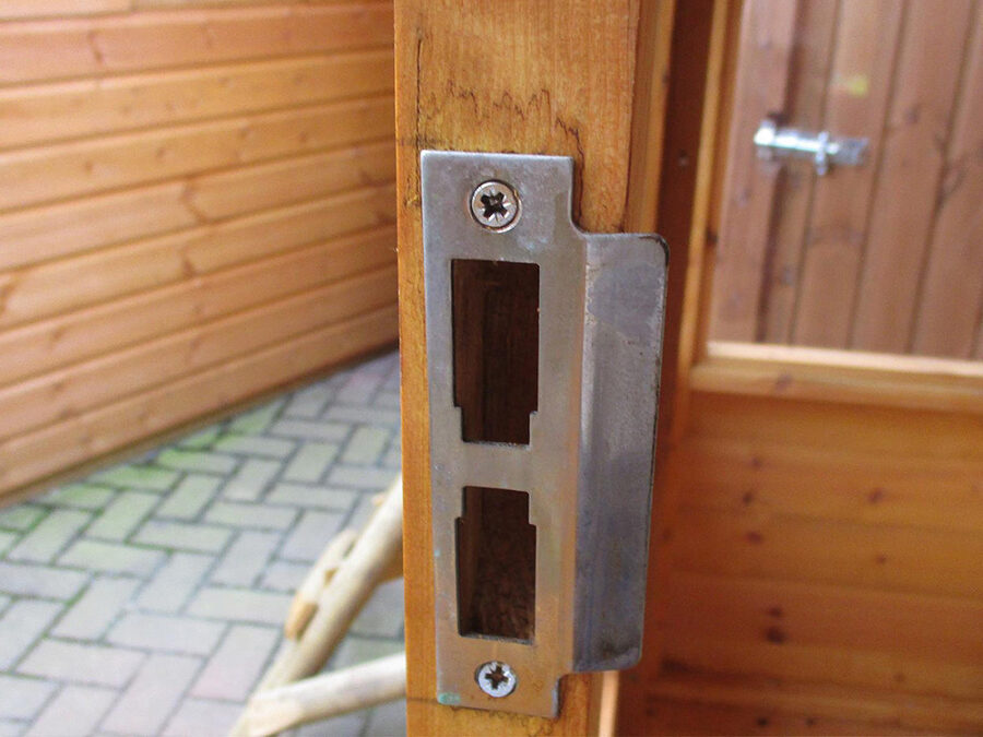 A close up image of the strike plates and locking mechanism on a wooden Georgian Corner Summerhouse