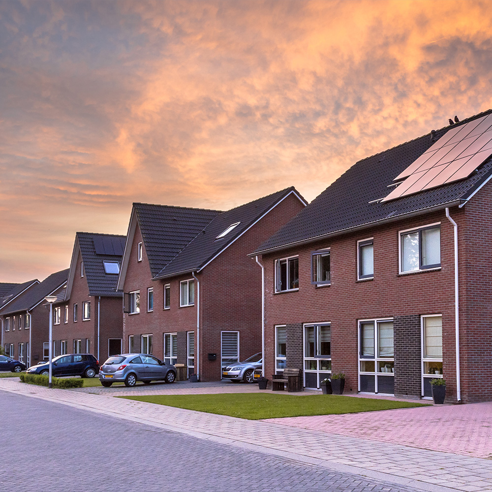 A row of modern houses in a new building development space