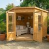 A wooden Standard Corner Summerhouse with the central double doors open showing the right side of the interior