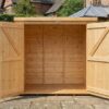 A front view of a wooden Tool Shed with 2 central doors on wooden decking