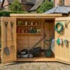 Bike shed with double doors open showing interior storage space — Rutland Sheds
