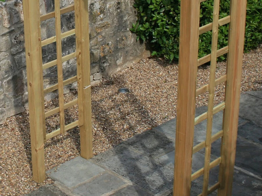 A close up image of the square side trellis details of the wooden Avon Garden Arch product