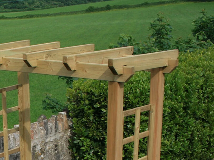 A close up image of the flat top of the wooden Avon Garden Arch product