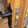 A close up image of the door and lock mechanism on a wooden Contemporary Summerhouse