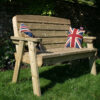 A Hutton Dean 2 Seater wooden garden furniture, with union flag pillows in a garden setting