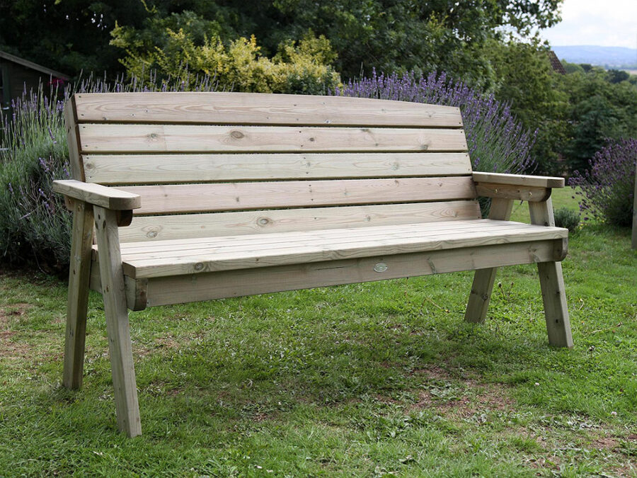 A Hutton Dean 3 Seater wooden garden furniture in a garden setting