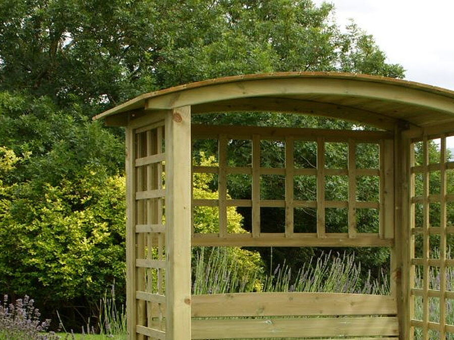A close up image of the curved roof top, and square side trellis details of the wooden Northwood Arbour product