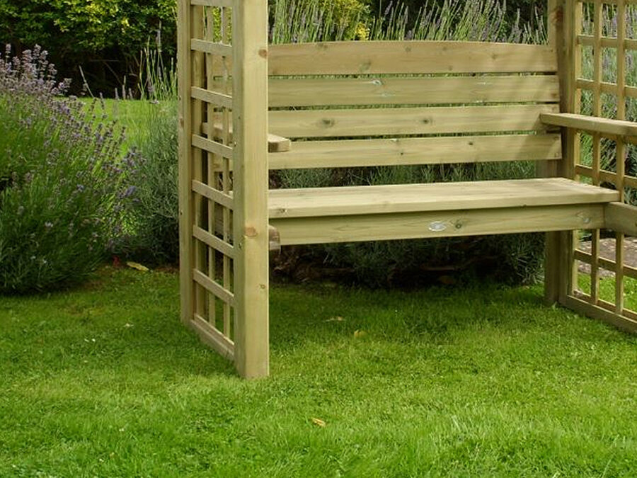 A close up of the seating area and square side trellis details of the wooden Northwood Arbour product